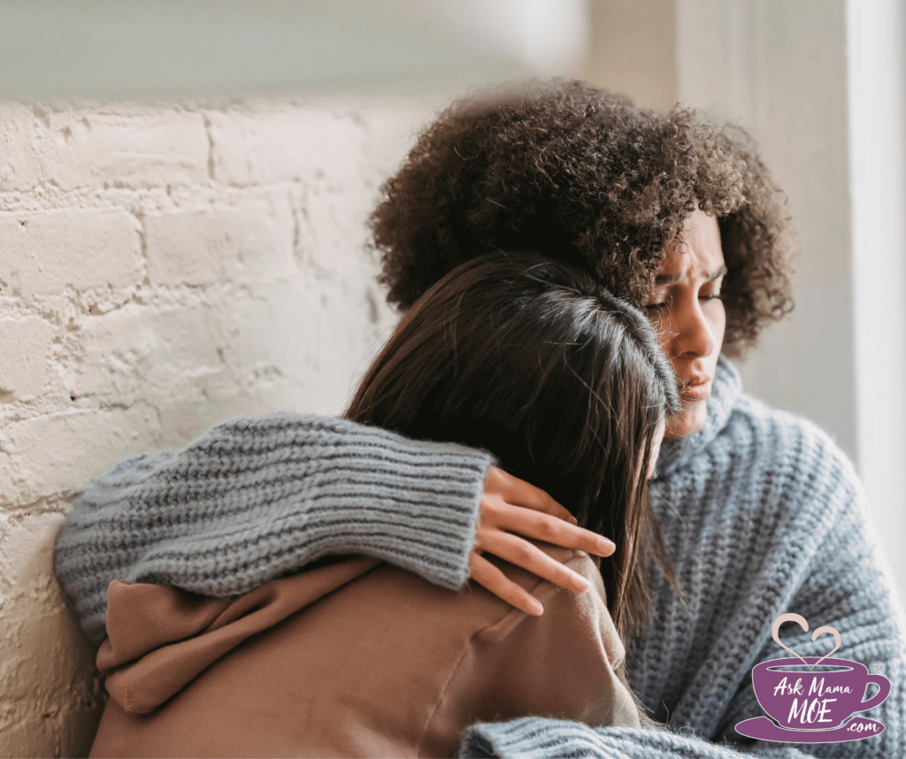 Two women hugging each other