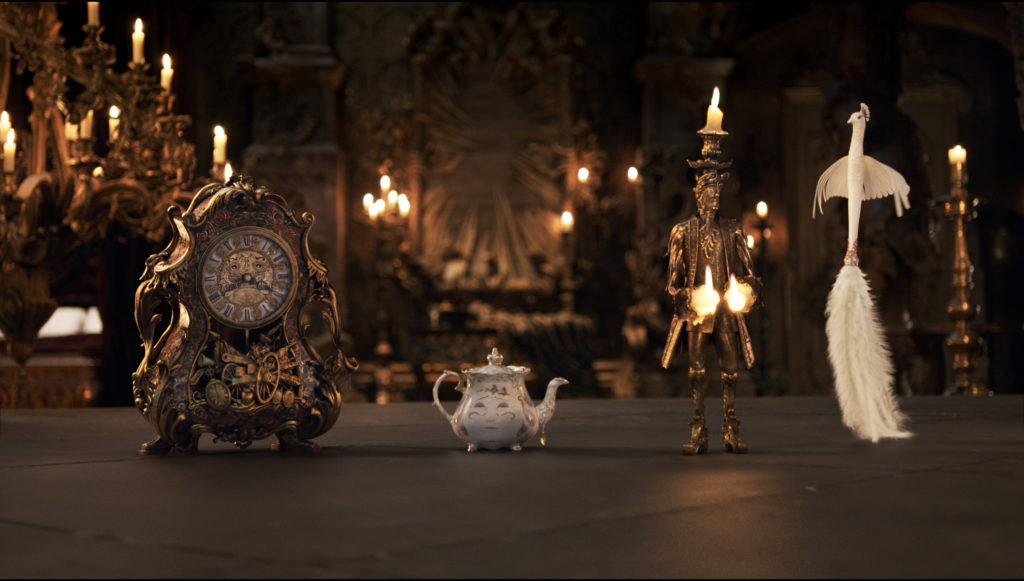 The mantel clock Cogsworth (IAN MCKELLEN), the teapot Mrs. Potts (Emma Thompson), Lumiere the candelabra (Ewan McGregor) and the feather duster Plumette (GUGU MBATHA-RAW)