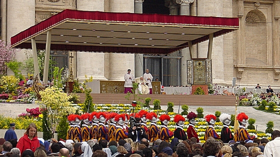 A view of the pope on the altar as he gives Easter Sunday mass. Swiss Guards watch over as the mass is celebrated.